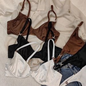 Lustrous satin bras in brown, black and white featuring elegant rhinestone buckles