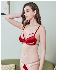 Detail of red and beige seamless lingerie set with underwire bra and matching panties