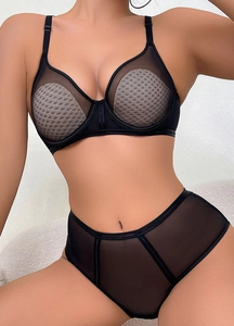 Detail of black sheer mesh lingerie set featuring wave texture fabric and adjustable straps