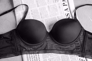 Detailed view of black seamless bra with fashion letter mesh wings and thin straps