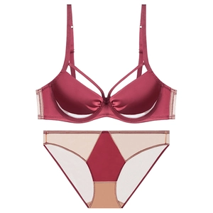 Burgundy satin lingerie set with caged cup detail and sheer mesh paneling