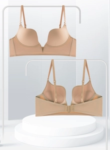 Detail of nude deep V seamless bra showing adjustable straps and multi-row back closure