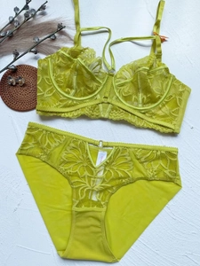 Detailed flat lay of lime green lace lingerie set with wired bra and matching panties