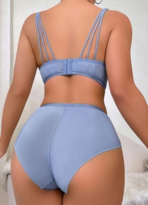 Detail of blue sheer mesh bra set with multi-strap design and high waist panties