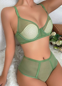 Detail of green mesh bra with honeycomb texture and adjustable straps for support