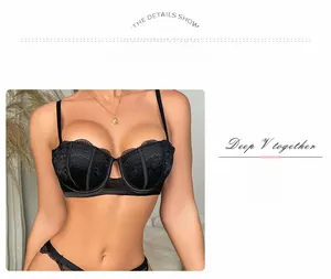 Detail of black floral lace embroidery on deep V-neck push-up bra with underwire support