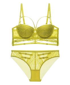 Detailed close-up of lime green lace lingerie set featuring delicate mesh and strappy details