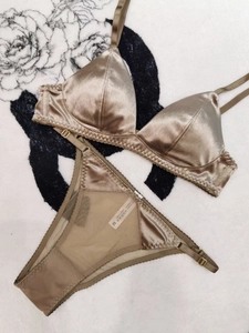 Detailed view of champagne silk velvet bra with lace trim and mesh back underwear set