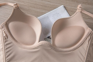 Macro detail of seamless nude beige bra featuring padded push-up cups and smooth fabric