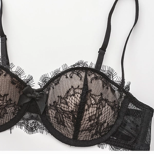 Close-up of black floral eyelash lace bra with semi-cup design and bow detail