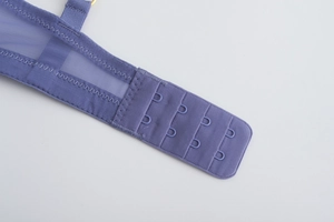 Detail of purple lace bra featuring four-row hook closure and breathable mesh fabric