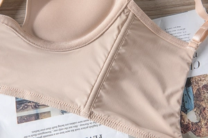 Detailed macro view of seamless nude bra stitching with breathable round chest pads