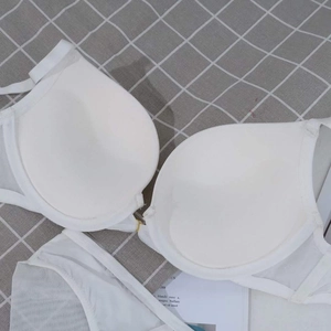 Detail view of white push-up mesh bra set with thick padding for enhanced lift