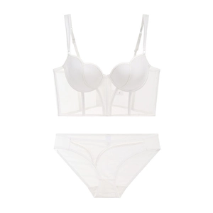 Detailed close-up of white mesh lingerie set with semi-sheer panels and wavy textures