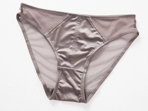 Detail view of mauve low-rise briefs featuring mesh panels and silky satin front fabric