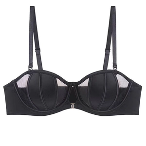 Detail of black seamless half-cup bra with vertical stitching and sheer mesh paneling