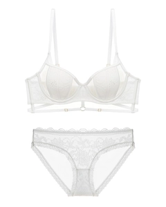 Detailed view of white floral lace lingerie set with mesh fabric and dainty gold hardware
