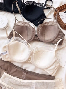 Detailed view of lace trim, front-buckle closure, and cotton lining on a French style bra