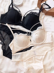 Detailed view of lace trim and front buckle design on elegant French style bras