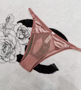 Detail of dusty rose velvet and lace thong with adjustable side straps in size L