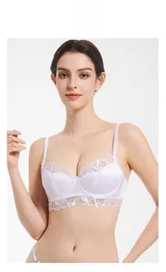 Close-up of elegant white satin and eyelash lace bra with supportive underwire detail