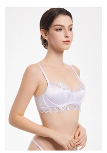 Detail of white satin and eyelash lace bra with adjustable thin shoulder straps