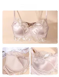 Detail view of champagne satin bra featuring 3D floral lace trim and soft underwire support