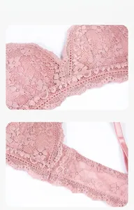 Vue détaillée des bretelles et des ailes latérales en dentelle rose poudré du soutien-gorge