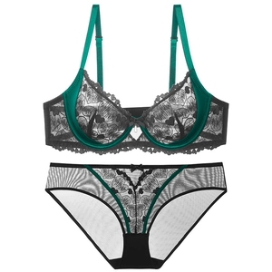 Lace lingerie set with heart patterns, featuring a dark green bra and matching panty