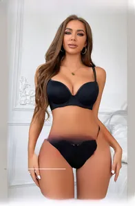 Detail of black seamless push up bra set with delicate lace trim on cup edges and straps