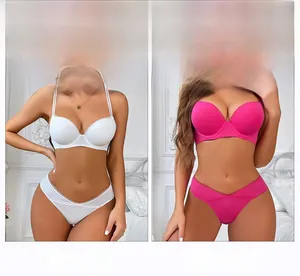 Detail view of seamless push-up bra set showing scalloped edges in white and rose pink