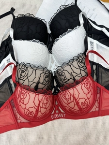 Close-up of rose embroidery and elegant rhinestone lettering on sexy lace bra sets