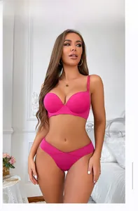 Lace trim push-up bra and panty set in vibrant rose red shown on a model in a bedroom