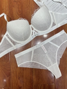 Detailed white lace lingerie set with rose embroidery and Elegant letter branding