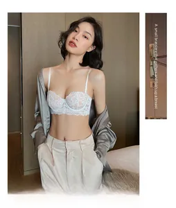 French lace bra styled with a silk shirt and suit pants for a chic layered look