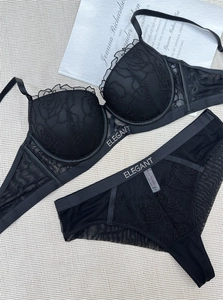 Detail of black lace lingerie set with rose embroidery and Elegant letters on band