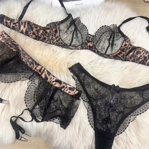 Three-piece leopard print lingerie set with floral lace embroidery and satin bows