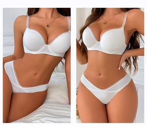 Detail of white seamless lace bra and V-shape panty set with double shoulder straps