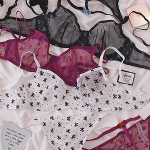 Set lingerie in pizzo con stampa fiocchi in nero, viola e bianco con supporto ferretto
