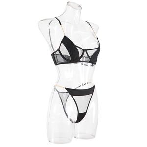 Close-up of black sheer mesh lingerie set featuring elegant gold metal chain straps