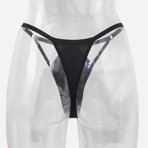 Detail of black seamless thong featuring rose gold metal rings on the side straps