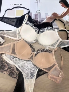 French style lace lingerie set with floral embroidery on wooden table background