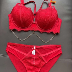 Sexy red lace lingerie set with push-up bra and matching strappy cutout panties