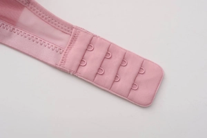 Detail showing four-row back hook and eye closure on breathable pink lace bra