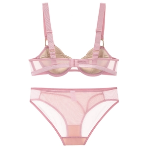 Detail of pink mesh bra with adjustable metal buckles on straps and breathable fabric