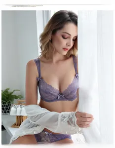 Detailed view of purple lace lingerie set with bow details and sheer white cover-up