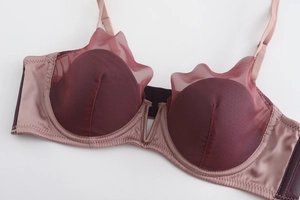 Close-up of deep red mesh bra with wave-edge dot lace and dusty pink silk straps