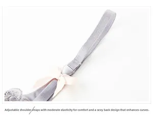 Detail of adjustable grey shoulder strap with small pink bow on thin lace bra