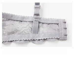 Detailed close-up of lavender floral lace wings and three-row hook closure on the bra