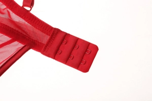 Detail view of red lace bodysuit showing the three-row hook-and-eye back closure